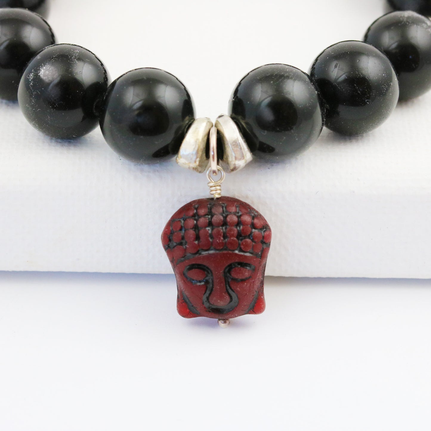 close up of buddha bead round black onyx beads stretch bracelet