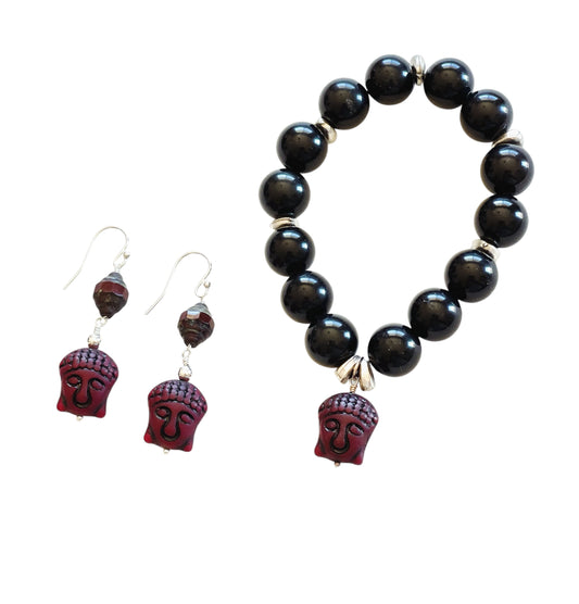 round black onyx beads with Czech glass buddha bead stretch bracelet. Earrings with buddha beads and complimentary red bead, sterling silver ear hooks.